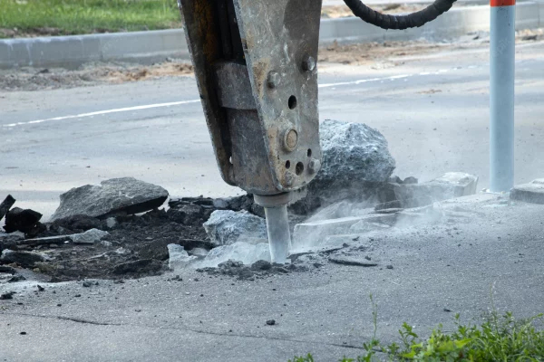 road-repair-removal-old-layer-asphalt-with-hydraulic-hammer-pavement-reconstruction_317451-84